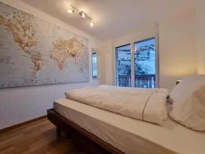 Ein Bett oder Betten in einem Zimmer der Unterkunft Mountain Village Residence