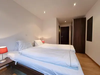 Ein Bett oder Betten in einem Zimmer der Unterkunft Mountain Village Residence