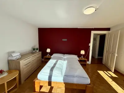Ein Bett oder Betten in einem Zimmer der Unterkunft Uptown Apartments Interlaken free Parking
