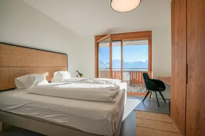 Ein Bett oder Betten in einem Zimmer der Unterkunft Golmenegg B Hörnliblick