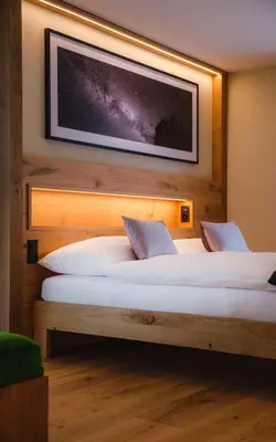 Ein Bett oder Betten in einem Zimmer der Unterkunft Hotel Tannenhof