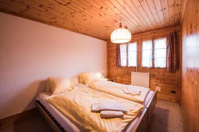 Ein Bett oder Betten in einem Zimmer der Unterkunft Chalet Bergwelt - Panoramic view