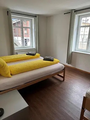 Ein Bett oder Betten in einem Zimmer der Unterkunft Hotel WALZ