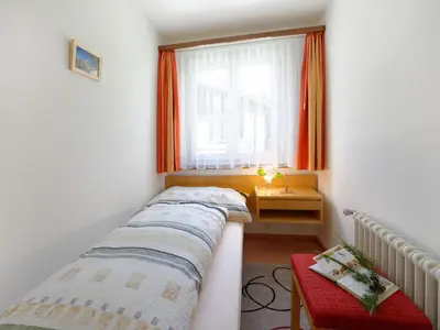 Ein Bett oder Betten in einem Zimmer der Unterkunft Apartment Hubertus-2 by Interhome