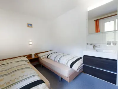 Ein Bett oder Betten in einem Zimmer der Unterkunft Apartment Hubertus-2 by Interhome