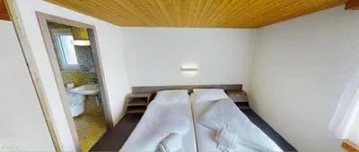 Ein Bett oder Betten in einem Zimmer der Unterkunft Boutique Hotel & Restaurant Bären Ringgenberg