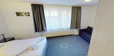 Ein Bett oder Betten in einem Zimmer der Unterkunft Boutique Hotel & Restaurant Bären Ringgenberg