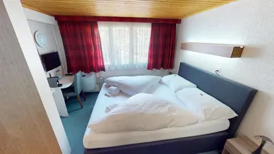 Ein Bett oder Betten in einem Zimmer der Unterkunft Boutique Hotel & Restaurant Bären Ringgenberg
