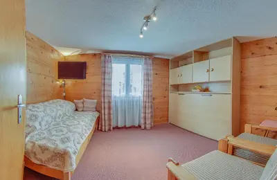 Ein Bett oder Betten in einem Zimmer der Unterkunft Anemone