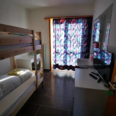 Ein Bett oder Betten in einem Zimmer der Unterkunft Ferienwohnung Crea
