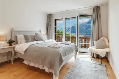 Ein Bett oder Betten in einem Zimmer der Unterkunft Chalet Alpenheim 1