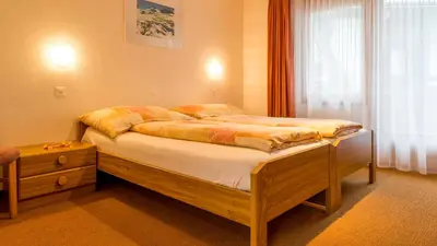 Ein Bett oder Betten in einem Zimmer der Unterkunft Haus Alpenglück