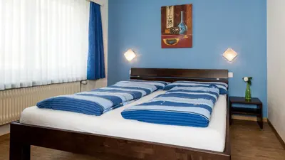 Ein Bett oder Betten in einem Zimmer der Unterkunft Haus Aristella