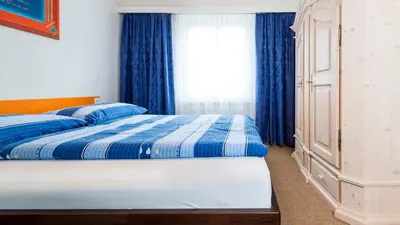 Ein Bett oder Betten in einem Zimmer der Unterkunft Haus Aristella