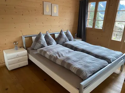 Ein Bett oder Betten in einem Zimmer der Unterkunft Büehl Lenk