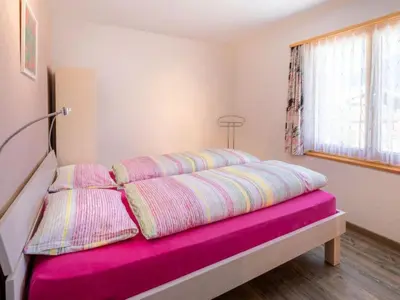 Ein Bett oder Betten in einem Zimmer der Unterkunft Apartment Hübeli - Moosmatten by Interhome