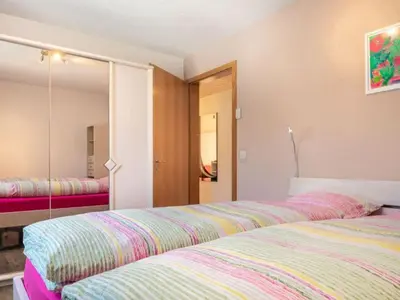Ein Bett oder Betten in einem Zimmer der Unterkunft Apartment Hübeli - Moosmatten by Interhome
