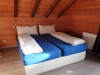 Ein Bett oder Betten in einem Zimmer der Unterkunft Tschuggen 4