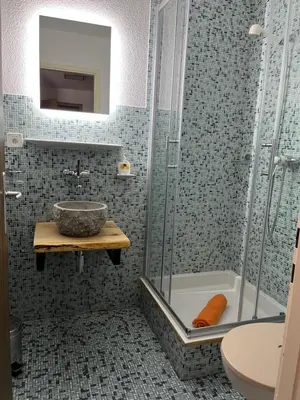 Ein Badezimmer in der Unterkunft Haus Atlantic Leukerbad