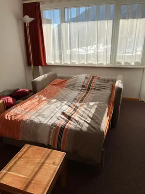 Ein Bett oder Betten in einem Zimmer der Unterkunft Haus Atlantic Leukerbad