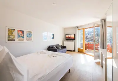 Ein Bett oder Betten in einem Zimmer der Unterkunft Eiger Residence