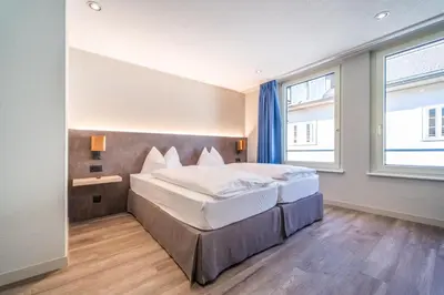 Ein Bett oder Betten in einem Zimmer der Unterkunft The Guesthouse by The Hey Hotel