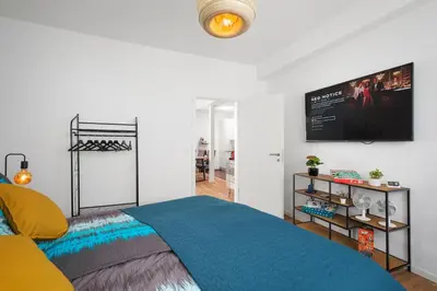 Ein Bett oder Betten in einem Zimmer der Unterkunft Spirit Apartments - Zentral am See - Parkplatz