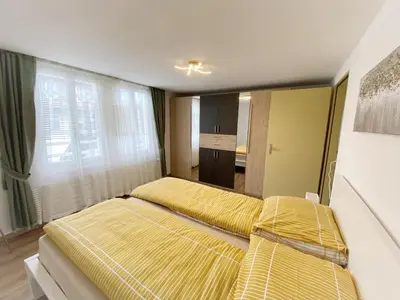Ein Bett oder Betten in einem Zimmer der Unterkunft Holiday Apartments Falke
