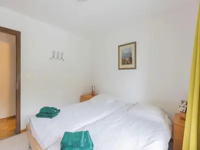Ein Bett oder Betten in einem Zimmer der Unterkunft Apartment Crans-Montana near Ski Slopes