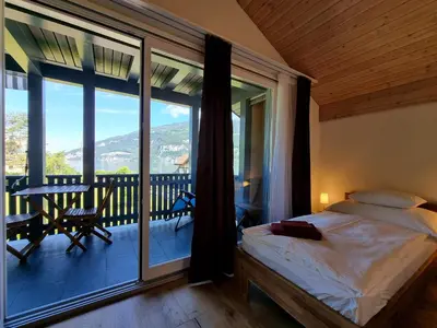 Ein Bett oder Betten in einem Zimmer der Unterkunft Seeparadiesli am schönen Thunersee