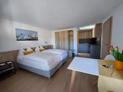 Ein Bett oder Betten in einem Zimmer der Unterkunft Modernes Studio Zermatt