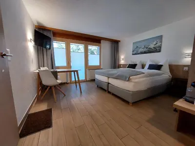 Ein Bett oder Betten in einem Zimmer der Unterkunft Modernes Studio Zermatt