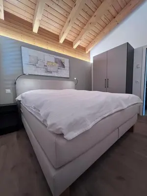 Ein Bett oder Betten in einem Zimmer der Unterkunft Residence Edelweiss No Stress by Eva