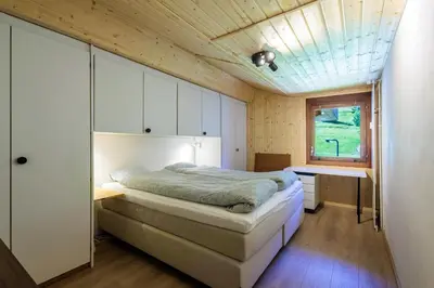 Ein Bett oder Betten in einem Zimmer der Unterkunft Superbe appartement, en 2 parties, au centre d'Anzère