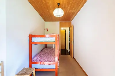 Ein Bett oder Betten in einem Zimmer der Unterkunft Superbe appartement, en 2 parties, au centre d'Anzère