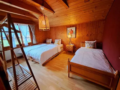 Ein Bett oder Betten in einem Zimmer der Unterkunft Sawasdee Swiss Chalet Wilderswil