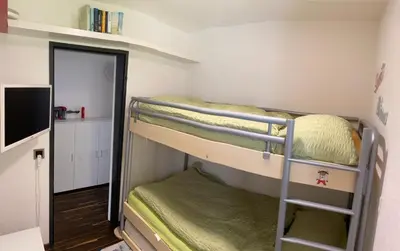 Ein Etagenbett oder Etagenbetten in einem Zimmer der Unterkunft Apartment Zayetta Nr. 16