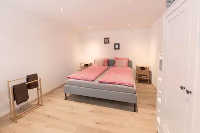 Ein Bett oder Betten in einem Zimmer der Unterkunft MOM - Alpine Boutique Apartments, Alpstein Eiger View Terrace, City Center