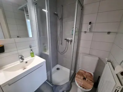 Ein Badezimmer in der Unterkunft MOM - Alpine Boutique Apartments, Alpstein Eiger View Terrace, City Center