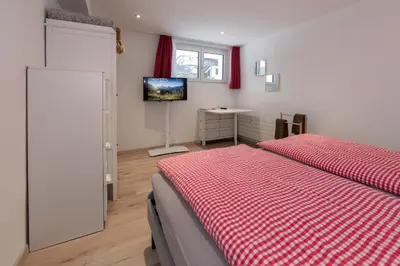 Ein Bett oder Betten in einem Zimmer der Unterkunft MOM - Alpine Boutique Apartments, Alpstein Eiger View Terrace, City Center