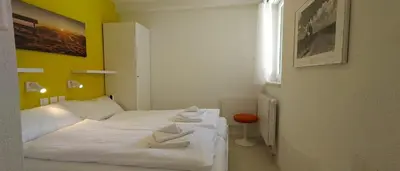 Ein Bett oder Betten in einem Zimmer der Unterkunft Cristal 68