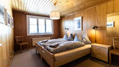 Ein Bett oder Betten in einem Zimmer der Unterkunft Haus Alpsegen, Riederalp Alpsegen Riederalp
