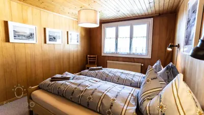 Ein Bett oder Betten in einem Zimmer der Unterkunft Haus Alpsegen, Riederalp Alpsegen Riederalp