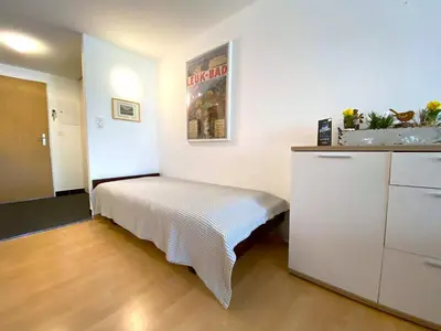 Ein Bett oder Betten in einem Zimmer der Unterkunft Adler 81
