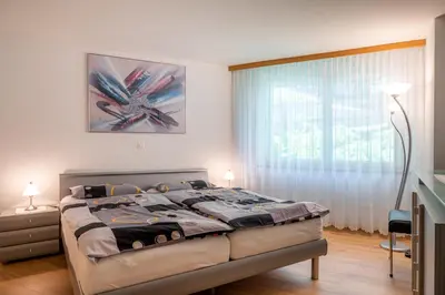 Ein Bett oder Betten in einem Zimmer der Unterkunft Sunnäplätzli- Aprt. 4p Matterhorn view/Wifi