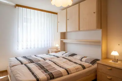Ein Bett oder Betten in einem Zimmer der Unterkunft Sunnäplätzli- Aprt. 4p Matterhorn view/Wifi