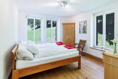 Ein Bett oder Betten in einem Zimmer der Unterkunft Le Manoir 5