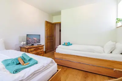 Ein Bett oder Betten in einem Zimmer der Unterkunft Le Manoir 5