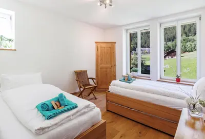 Ein Bett oder Betten in einem Zimmer der Unterkunft Le Manoir 5
