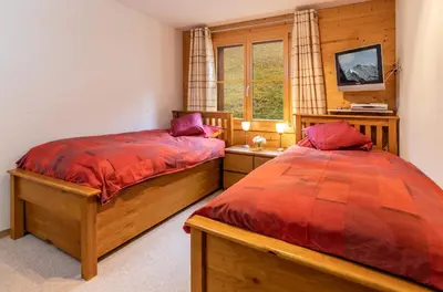 Ein Bett oder Betten in einem Zimmer der Unterkunft Chalet Bergrose 4